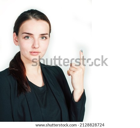young pretty girl pointing on white background, business science people concept