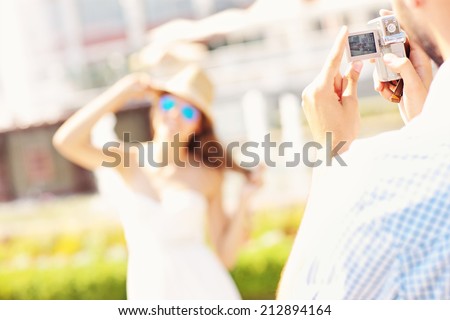 A blurred picture of a woman posing to the camera