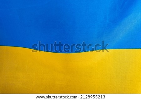 Flag of Ukraine, UA. Blue and yellow colors. Close up shot, background