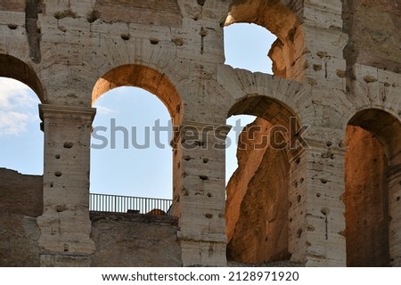 Detail of Colosseum in Rome (Roma), Italy. Also named Coliseum, this is the most famous Italian sightseeing. Sunrise time. Royalty-Free Stock Photo #2128971920