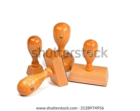 Various wooden stamps against white background