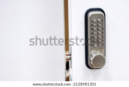 Digital door lock. Door safety system, code keypad closeup. Open door with control system using digital locking and password to acces Royalty-Free Stock Photo #2128981301