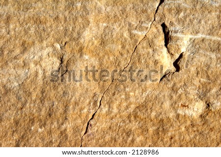 reddish face of stone - different structures - landscape format