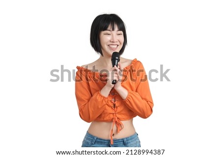 Young asian woman talking with her audience through microphone, isolated on white background.