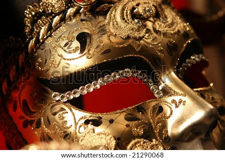 Ornate handmade venetian mask on red background