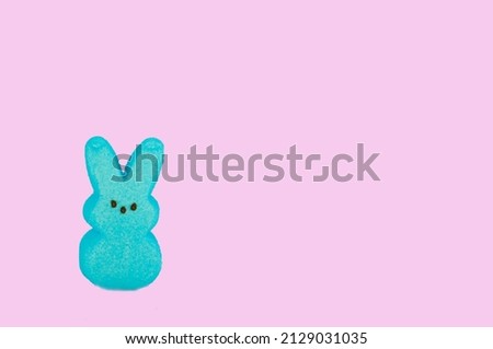 Various Pink and Blue Marshmallow Easter Candy on Colorful Backgrounds