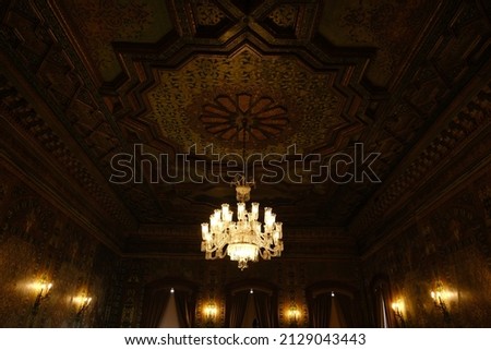 Ceiling design and lighting art in the Ottoman period. large chandelier. rembrandt style lighting. Selective focus on chandelier. the background is a little dark. Royalty-Free Stock Photo #2129043443