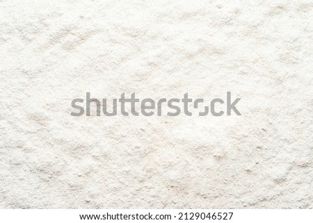 Background with flour. Sifted spelled flour texture. Royalty-Free Stock Photo #2129046527