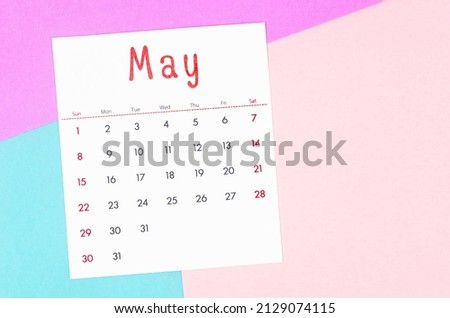 The May 2022 calendar on multicolored background.