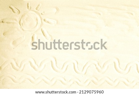 Banner, children's drawing on the white sea sand sun, waves.  The concept of vacation, travel.  Summer holidays, vacation.  Flat layout, top view photo.  Close-up.