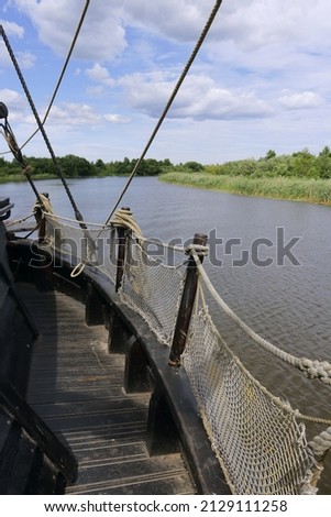 old wooden barge with sail