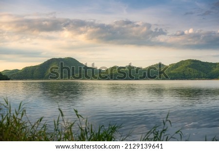 Mountain landscape, picturesque mountain lake in the summer morning, Beauty of nature concept background. lake and mountain on background in the morning time. natural landscape in Thailand. Royalty-Free Stock Photo #2129139641