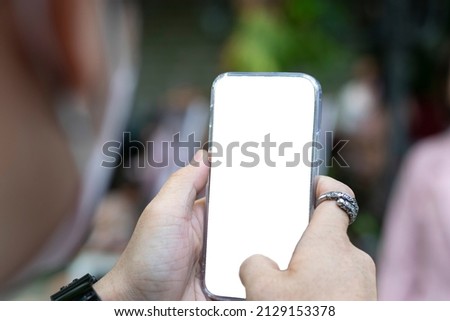 man using smartphone to take a photo of someone
