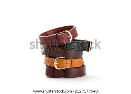 Leather bracelets arranged on a white background, space for text