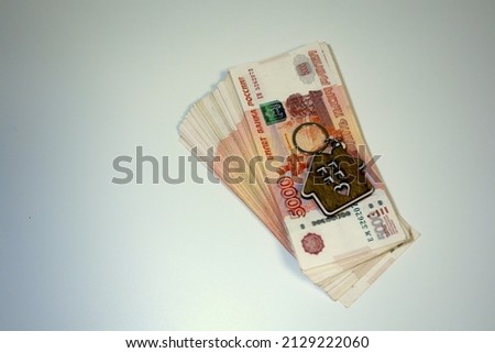 the concept of business, finance, savings, banking, travel and people is a close-up of a bundle of money in Russian banknotes of five rubles. mortgage. High quality photo