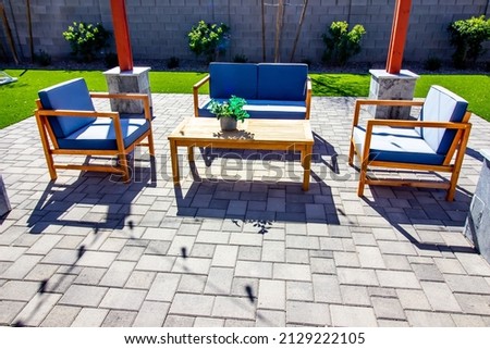 Rear Pavers Patio With Couch, Table And Two chairs