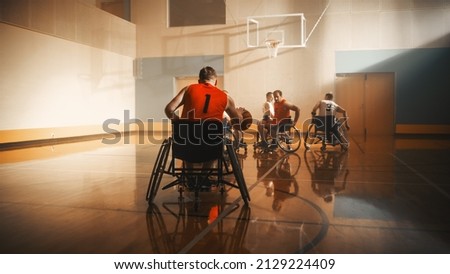 Wheelchair Basketball Game: Professional Players Competing, Dribbling Ball, ready to Pass or Shoot it Successfully, Score a Goal. Celebration of Determination, Skill, Speed of People with Disability
