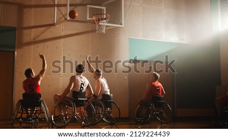 Wheelchair Basketball Game: Professional Players Competing, Dribbling Ball, Passing, Shooting it Successfully, Score a Perfect Goal. Determination and Skill of a People with Disability.