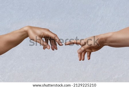 Michelangelo's masterpiece: the creation of Adam, as a photographic imitation. Royalty-Free Stock Photo #2129225210
