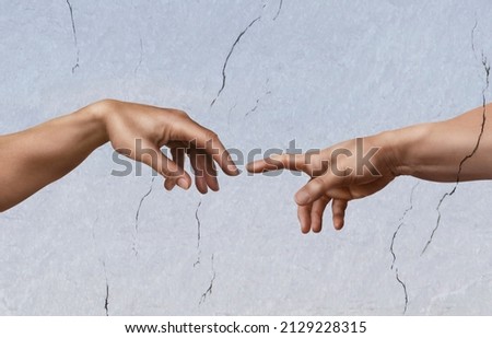 The creation of Adam, as a photographic imitation. Michelangelo's masterpiece.
The flash of light is to illustrate the moment of creation. Royalty-Free Stock Photo #2129228315