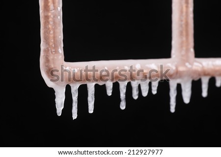 A frozen copper pipe Royalty-Free Stock Photo #212927977