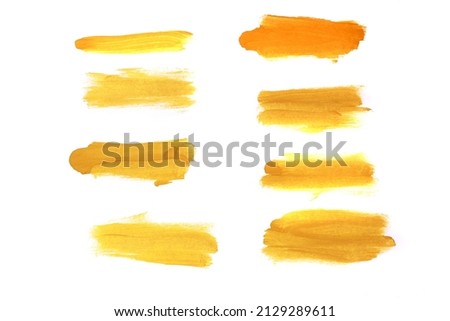set of yellow watercolor strokes isolated on white background