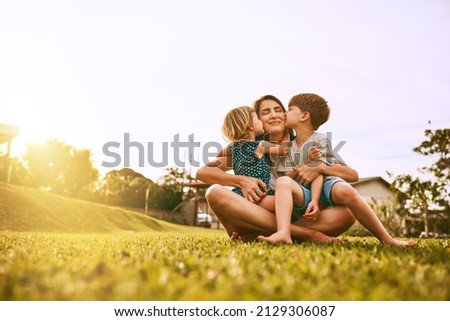 Kiss delivery for mom. Cropped shot of a young family spending time together outdoors. Royalty-Free Stock Photo #2129306087