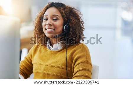 Customers care if you care not how much is known. Shot of a female agent working in a call centre. Royalty-Free Stock Photo #2129306741