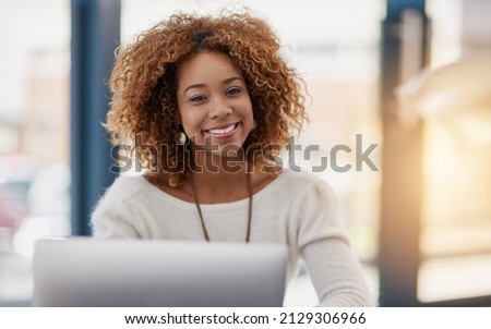 Building her business on success at a time. Portrait of a young businesswoman sitting at her laptop in an office. Royalty-Free Stock Photo #2129306966