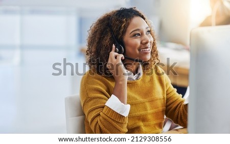 Her display of care in customers is great business. Shot of a female agent working in a call centre. Royalty-Free Stock Photo #2129308556