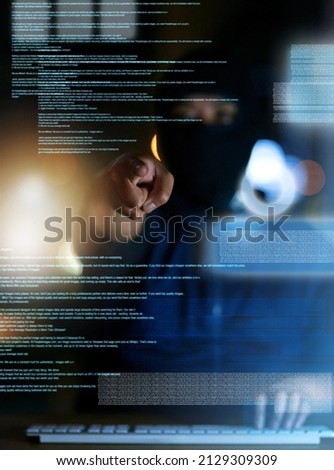 Youve been hacked. Shot of a hacker cracking a computer code in the dark.