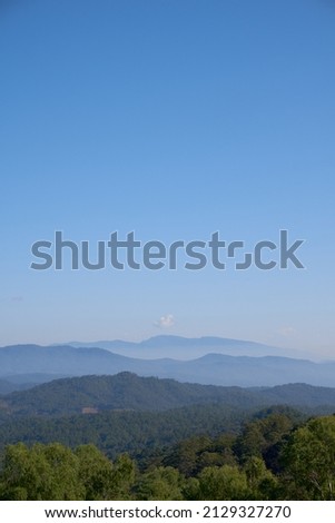 Beautiful landscape view of mountains with blue sky and cloud at Doi Inthanon national park at Doi Inthanon, Chiang Mai Province North of Thailand.