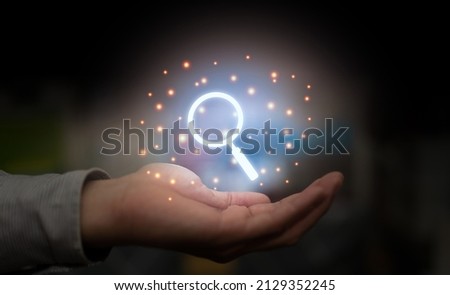 hand hold magnify glass for search technology concept