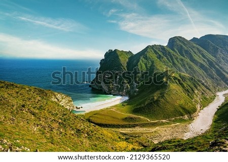 a  view  of mountains and sea in Al Mughsail Salalah, Sultanate of Oman Royalty-Free Stock Photo #2129365520