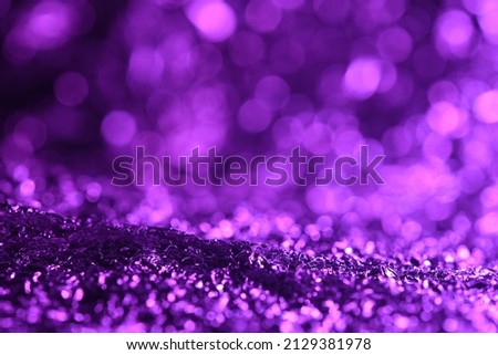 Purple glitter lights texture. Abstract christmas background.