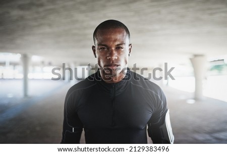 The city is my gym. Shot of a young person working out in and around the city. Royalty-Free Stock Photo #2129383496