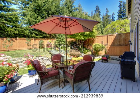 Beautiful landscape design for backyard garden and patio area on walkout deck