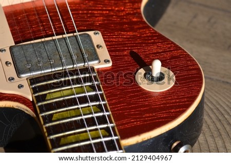 Vintage Red Sparkle Guitar in Sun Light