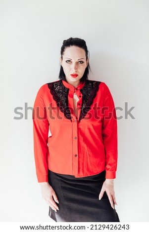 brunette woman in red business suit