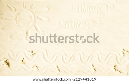 Banner, children's drawing on the white sea sand sun, waves, small pieces of coral.  The concept of vacation, travel.  Summer holidays, vacation.  Flat layout, top view photo.  Close-up.