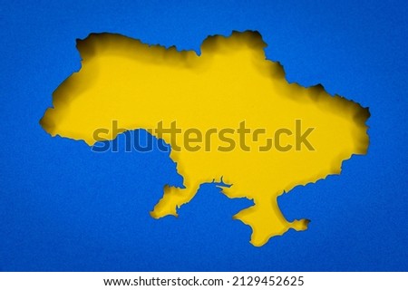 Ukraine map silhouette papercut, illustration photo for support in war against Russia Royalty-Free Stock Photo #2129452625