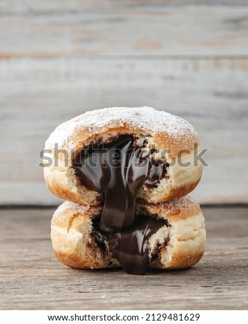 delicious donuts with chocolate filling Royalty-Free Stock Photo #2129481629