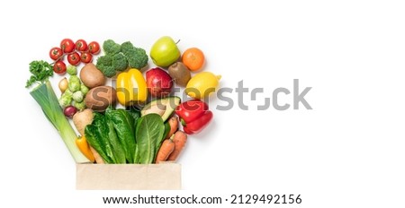 Healthy food background. Healthy food in paper bag vegetables and fruits on white. Food delivery, shopping food supermarket concept