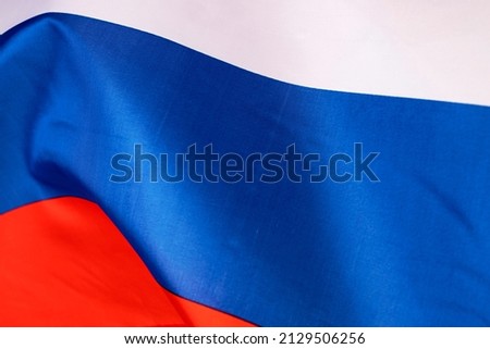 Waving colorful national flag of russia. Russian-Ukrainian conflict concept