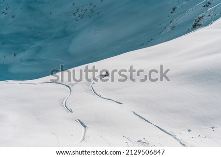 a picture of a someone snowboarding in the austrian alps