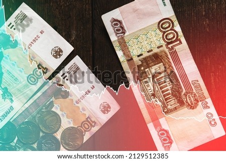 Background with  chart of falling Russian ruble price affected by economic sanctions Royalty-Free Stock Photo #2129512385