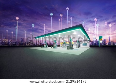 Petrol gas station station at night with spot location icon connect between city building 
