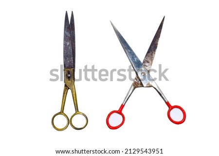The old scissors are separated isolated on a white background.