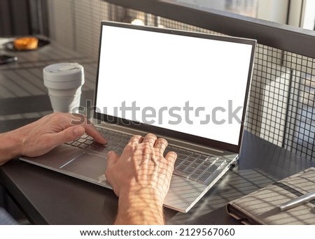 Laptop mockup with blank screen. Woman hands closeup typing on keyboard. Using computer for work, distant education, information search, social communication. High quality photo