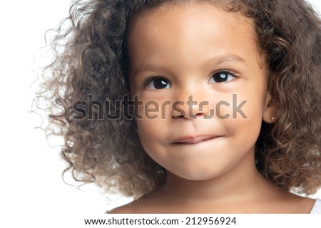 Close up portrait of a little girl with an afro hairstyle